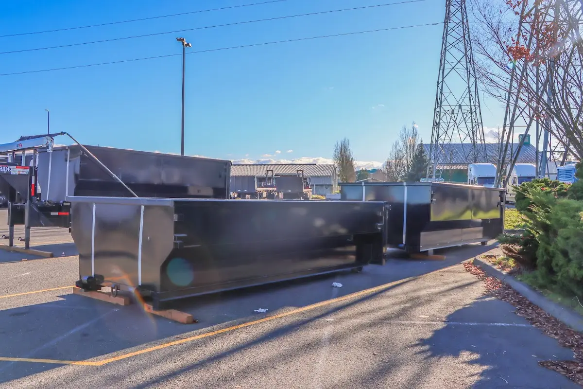 Roll-off dumpster ready for waste disposal at job site for 12 Yard Dumpster Rental in Hudson Falls